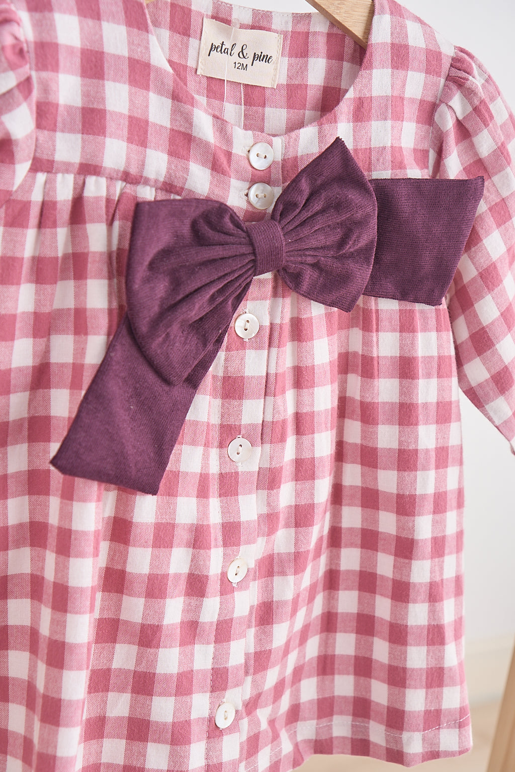 Pink gingham flannel bow dress